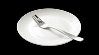 White ceramic dinner plate with silver fork isolated on transparent background, ready for restaurant menus, food blogs, stickers, and print on demand designs.