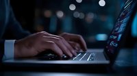 Professional businessman hands typing on laptop keyboard in modern office environment with bokeh lights creating atmospheric workspace ambiance for productivity.