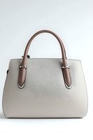 Elegant beige leather handbag with brown handles and silver hardware on white background, isolated product photo for fashion retail and accessory marketing.