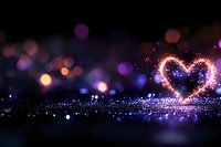 Glowing heart shape formed by sparkling particles against dark background with colorful bokeh lights creates romantic magical atmosphere. Suitable for Valentine designs.