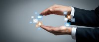 Businessman hands protecting digital communication icons including email and messaging symbols on gray background for technology concepts.