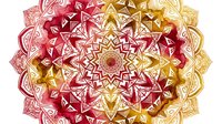 Ornate mandala with symmetrical geometric patterns in red, pink, and gold tones, featuring intricate star and diamond shapes radiating from center. Isolated on transparent background, ready for design projects.
