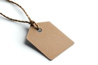 Blank kraft paper tag with twine string isolated on white background for product labeling, branding, or gift packaging.