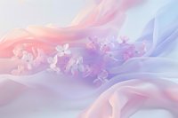 Delicate pink and purple orchids floating on soft flowing silk fabric create dreamy romantic atmosphere with gentle pastel colors and ethereal light effects.