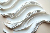Abstract white wavy layers create elegant flowing curves and shadows in minimalist composition. Clean modern design background with soft sculptural forms.