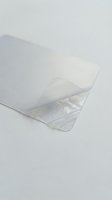 Clear transparent plastic bag opened on white background for packaging and storage solutions in commercial and retail applications.