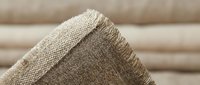 Natural burlap fabric texture with frayed edges showcasing organic hemp material for rustic crafts and eco-friendly packaging design projects.
