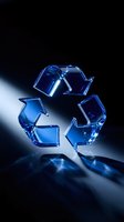 Blue glass recycling symbol floating above surface with dramatic lighting for environmental sustainability campaigns.