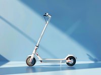 Modern white electric scooter on blue background with diagonal shadow pattern. Clean minimalist composition for transportation and urban mobility concepts.