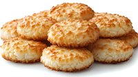 Fresh coconut macaroons with golden toasted exterior and soft chewy center arranged in group on white background, macro food photography.