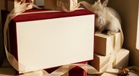 Blank burgundy greeting card with gold ribbon bow and kraft paper wrapping, ready for custom text or design projects.