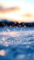 Magical winter sunset over frozen lake with sparkling snow and bokeh lights creating dreamy atmosphere. Soft focus close-up captures glistening ice crystals at dusk.