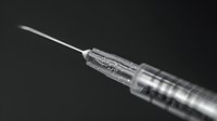 Medical syringe with needle isolated on black background, ready for vaccination or medication administration in healthcare settings.