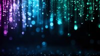 Magical glowing lights falling like rain against dark background, gradient from purple to blue bokeh effect creates dreamy atmosphere for festive designs.