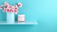 Pink cherry blossom flowers in white ceramic vase and cosmetic jar on glass shelf against turquoise blue wall, minimal spring beauty composition.