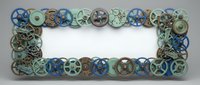 Vintage industrial gears and mechanical parts forming decorative border frame on white background. Steampunk style design element for crafting projects.