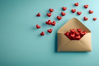 Open golden envelope with red hearts flying out on turquoise background. Romantic love letter concept for Valentine's day celebration or anniversary greeting.
