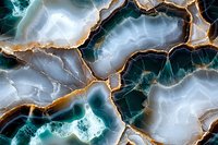 Luxurious agate stone texture with golden veins and turquoise accents creates elegant natural pattern for premium interior design and jewelry inspiration.