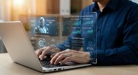Business professional analyzing financial data on laptop with holographic interface displaying charts, graphs and analytics dashboard for investment decisions.