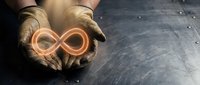 Hands holding glowing infinity symbol representing endless possibilities, eternal concepts, and limitless potential for business and personal growth applications.