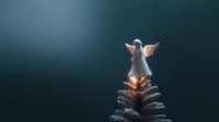 Glowing angel figurine atop miniature Christmas tree against dark blue background, creating magical holiday atmosphere.