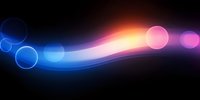 Glowing abstract wave with blue and pink bokeh lights on black background creates dynamic motion effect for modern tech designs and presentations.
