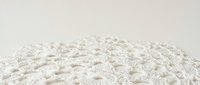 White flour powder heap with fine texture on neutral background for baking and cooking applications in food industry and culinary projects.