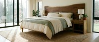 Modern bedroom interior with wooden bed frame and neutral bedding in bright natural light setting for home decor and lifestyle concepts.