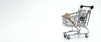 Shopping cart with cardboard box on white background, isolated retail and delivery concept for e-commerce design.