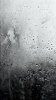 Raindrops on window glass create atmospheric moody backdrop with blurred dark cityscape behind, perfect for emotional storytelling and melancholic design projects in advertising and media.