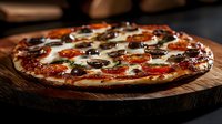 Delicious pizza with pepperoni, mushrooms and melted cheese on wooden board in restaurant kitchen setting for food delivery and dining menus.