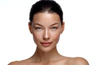 Young Asian woman with natural makeup, glowing healthy skin, and bare shoulders against white background, showcasing clean beauty and skincare results.