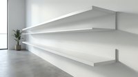 Modern white floating shelves mounted on minimalist wall with clean lines and contemporary design for home organization and interior decor solutions.