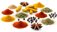 Colorful spices and herbs collection with turmeric, paprika, star anise, black peppercorns and aromatic seasonings isolated on white background for cooking.