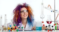 Female scientist with colorful hair conducting chemistry experiments in laboratory with beakers, flasks and molecular models for educational content.
