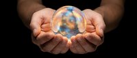Hands holding glowing globe with blue and gold light, symbolizing global business, technology innovation, and future vision for corporate and environmental concepts.