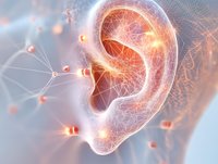 Glowing human ear with neural network connections showing hearing system and nerve impulses in orange and white tones on soft background.