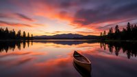 Wooden boat floating on calm lake at sunset with dramatic orange and purple sky, forested mountains, and mirror water reflections. Ideal for travel, nature, and outdoor design projects.