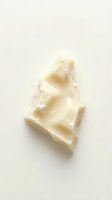 Melted white chocolate chunk isolated on neutral background, ready for culinary, confectionery, and food styling design projects.