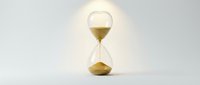 Hourglass with golden sand on white background, symbolizing time passage, deadline management, and business concepts for design projects.