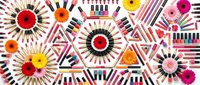 Colorful cosmetics flat lay with lipsticks, nail polishes, and gerbera flowers arranged in geometric patterns on white background.