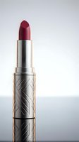 Luxury red lipstick with ornate silver case isolated on white background for beauty and cosmetics advertising campaigns.