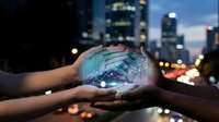 Hands holding glowing digital globe with network connections against blurred city skyline at dusk. Global technology and connectivity concept for business presentations.