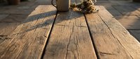 Weathered wooden planks with natural grain texture and rope detail create rustic outdoor surface for construction and carpentry projects.