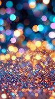 Magical sparkly background with glowing bokeh lights in blue, purple and gold colors creating dreamy festive atmosphere. Blurred defocused effect adds depth.