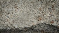 Weathered concrete surface with rough texture and natural aging, suitable for backgrounds, construction projects, industrial design, and architectural visualization.