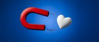 Red horseshoe magnet attracting white heart symbol on blue gradient background representing love attraction, romance magnetism and relationship concepts.
