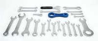 Professional mechanic tool set with wrenches and screwdrivers isolated on white background for automotive repair and maintenance work.