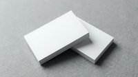 Blank white business cards mockup on gray textured surface for branding and corporate identity design projects.