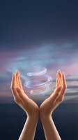 Open hands protecting glowing energy spiral against twilight sky background for wellness and spiritual healing concepts.